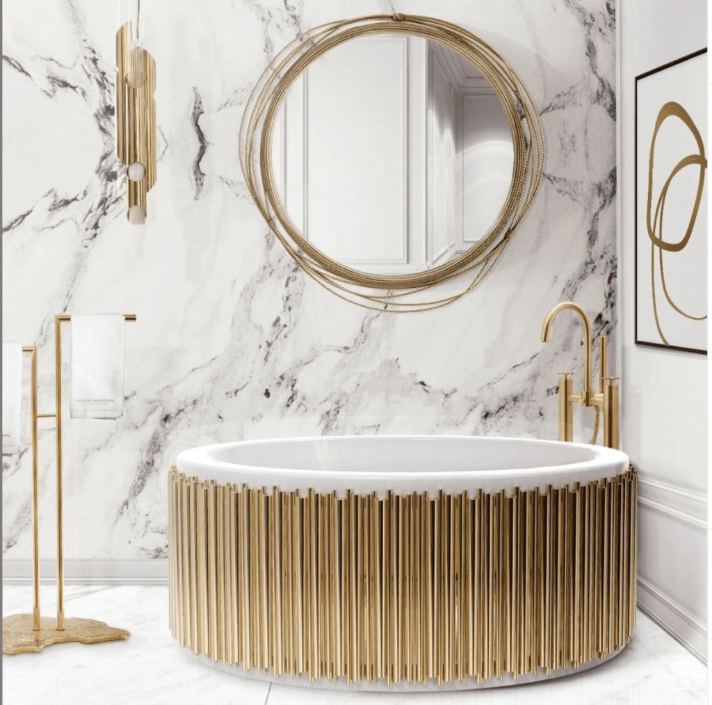 17. Round Gold-Framed Mirror in a Marble Bathroom