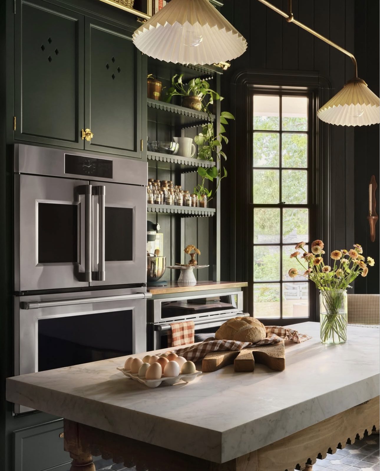 Atmospheric Emerald Kitchen Featuring Integrated Appliances
