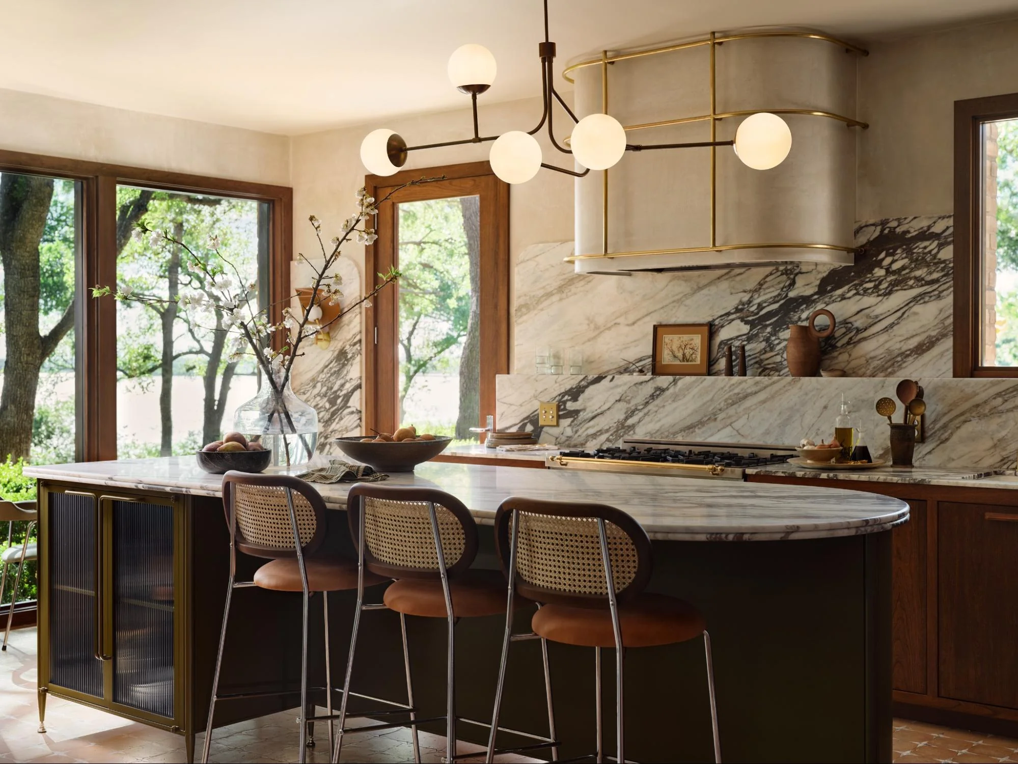 Cozy Culinary Space Featuring Elegant Marble and Gleaming Brass Details