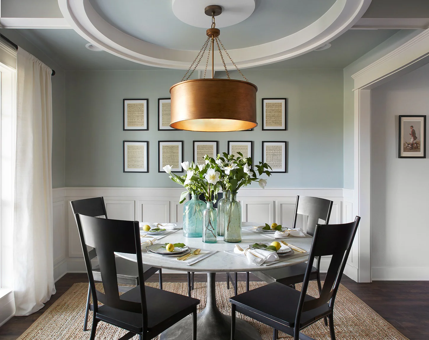 Elegant Round Dining Space with Layered Ceiling Details