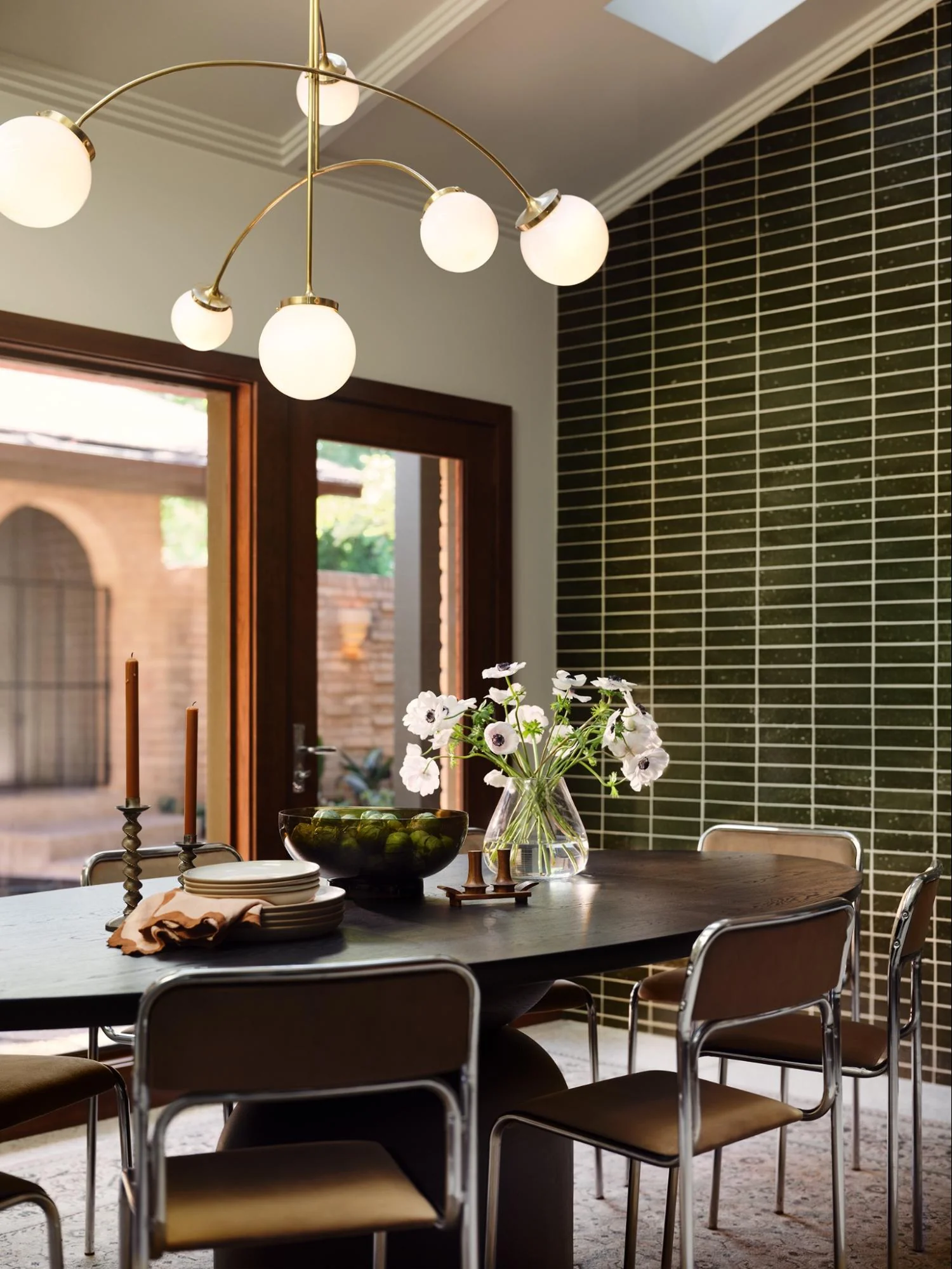 Vibrant Dining Space Accented by Green Tiles