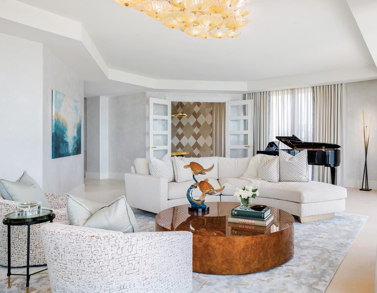 Elegant Cream Sectional Paired with a Lustrous Wood Burl Coffee Table