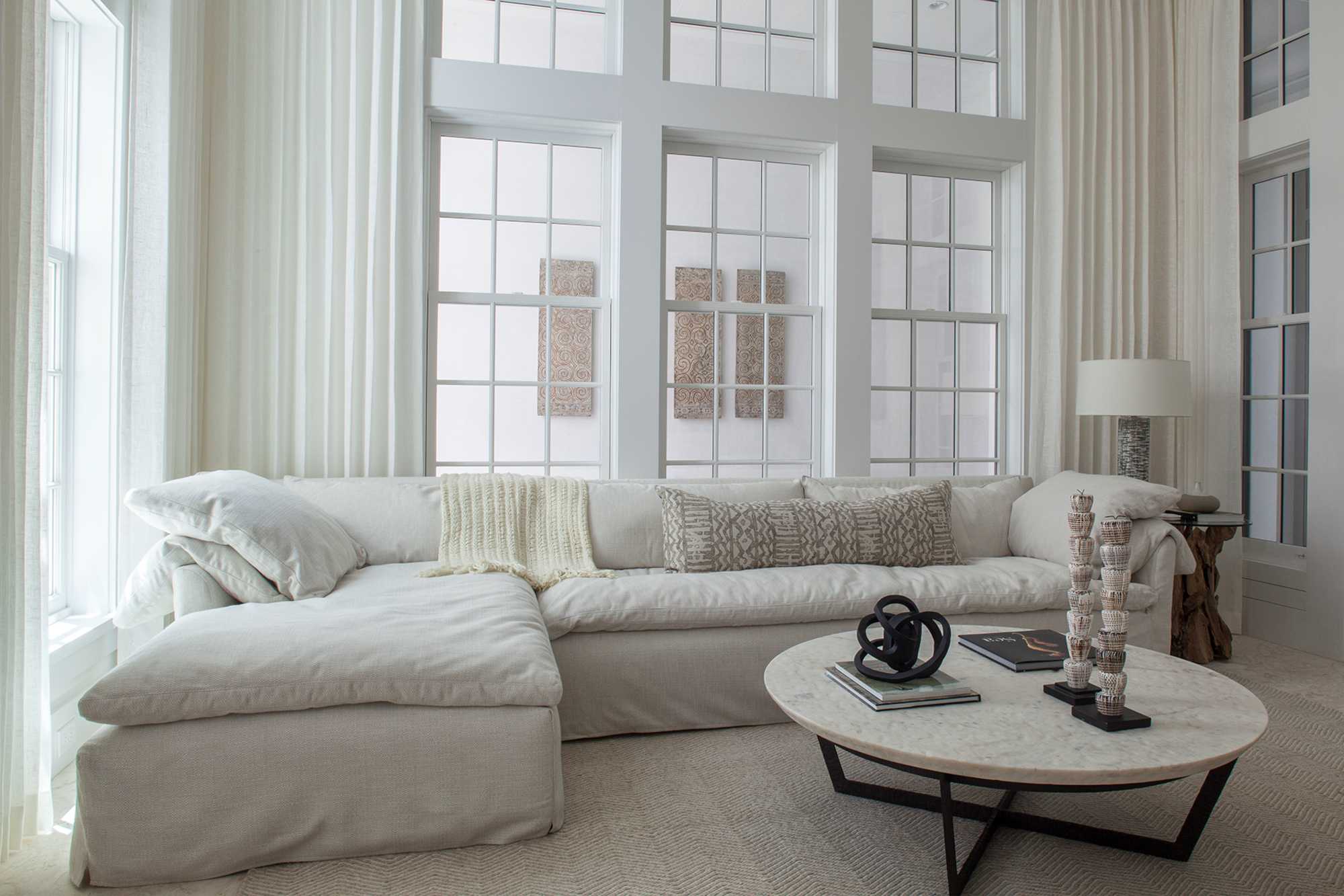 Bright Elegance with Floor-to-Ceiling White Sofa Living Rooms