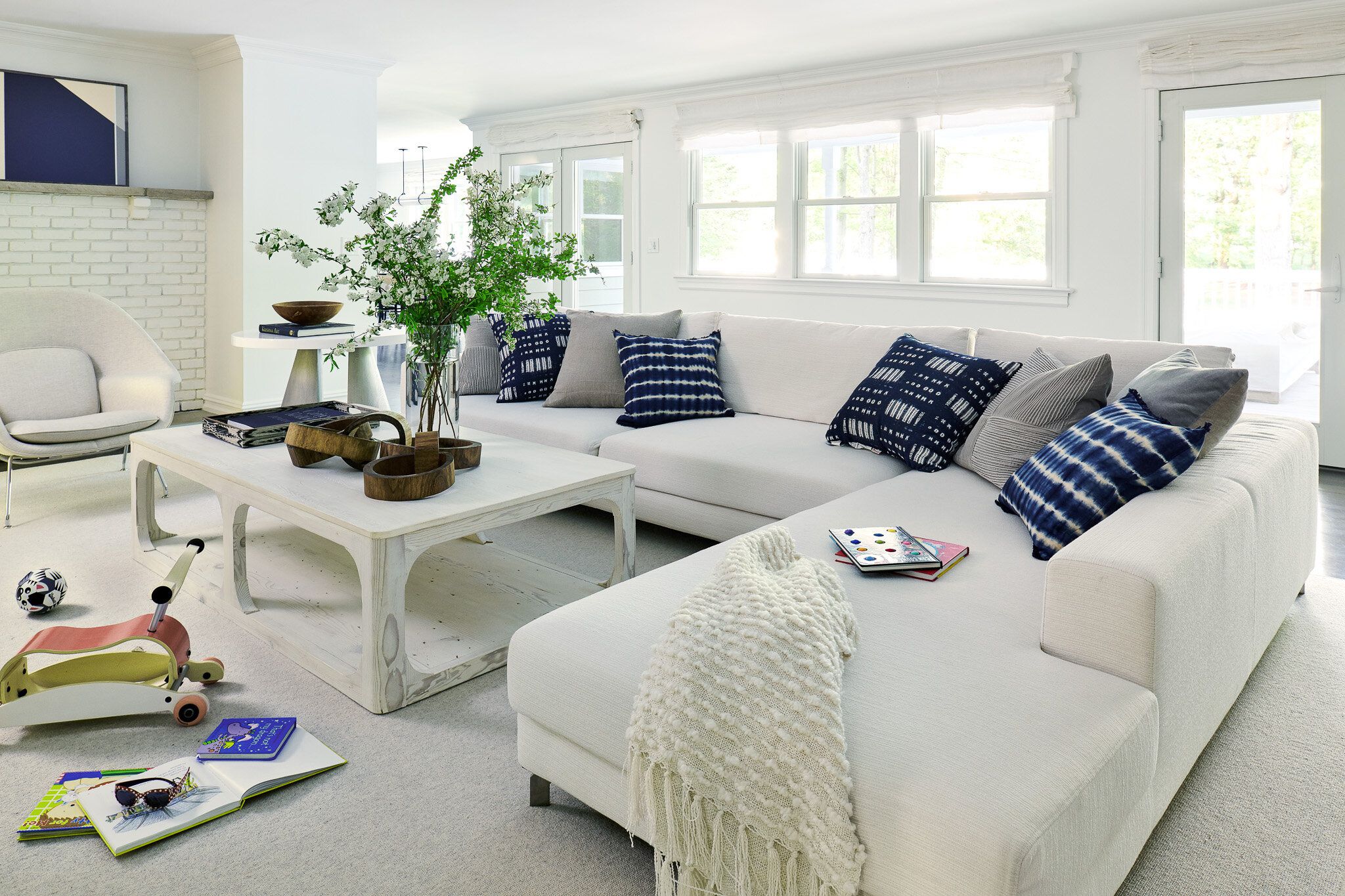 Serene White Sectional Paired with Ocean-Inspired Blues and Weathered Wood Accents