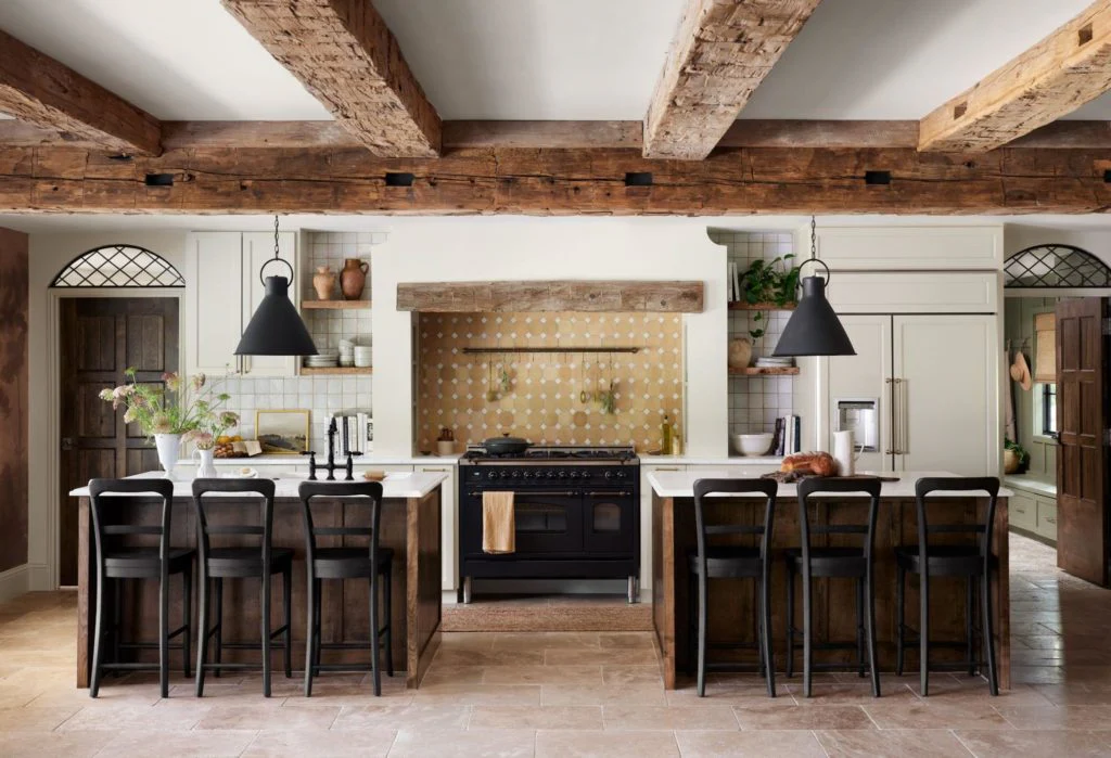 Charming Kitchen Featuring Exposed Wooden Beams and Bold Range