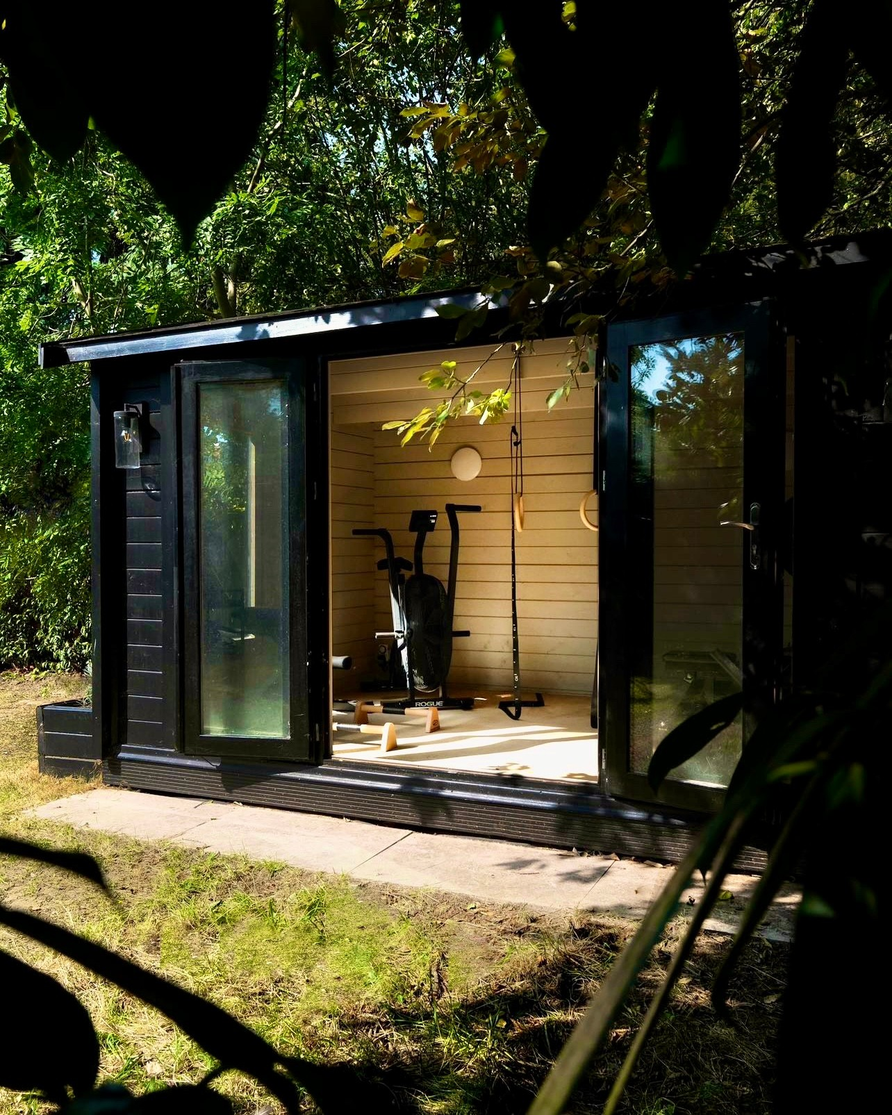 Striking Black Exterior Paired with Warm Wooden Interior