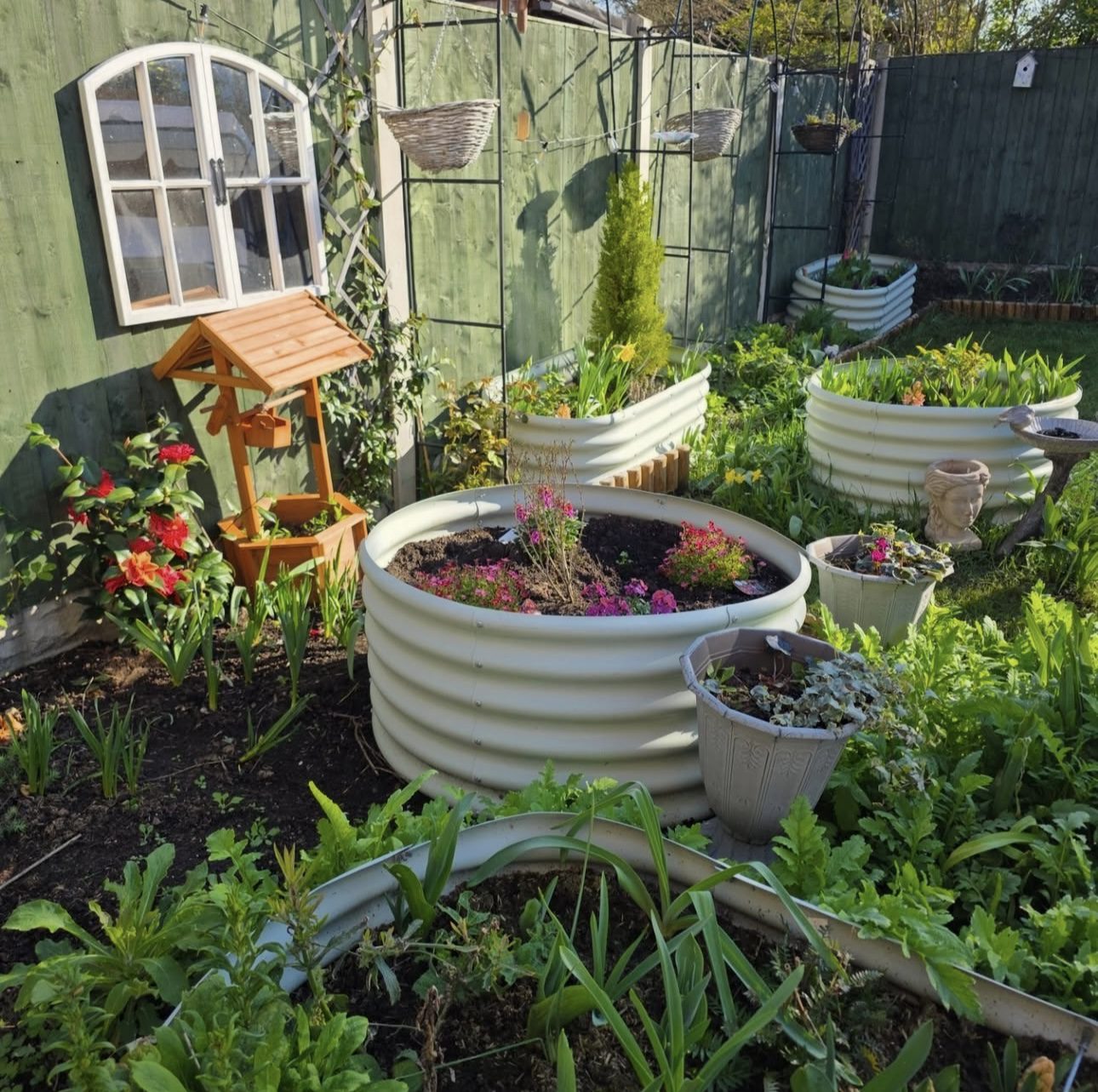 Round Corrugated Raised Beds for a Rustic Backyard Style
