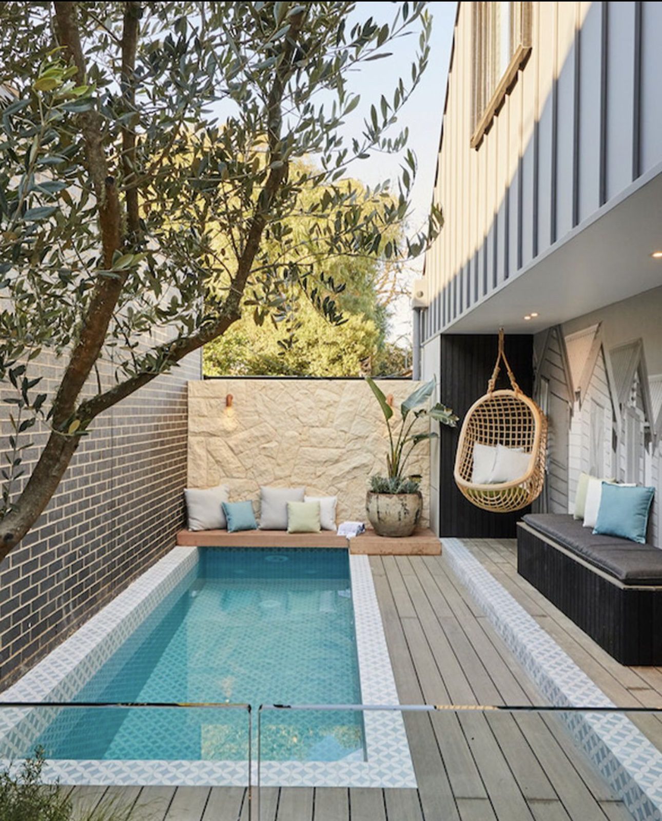 Sleek Narrow Pool Featuring an Integrated Seating Bench