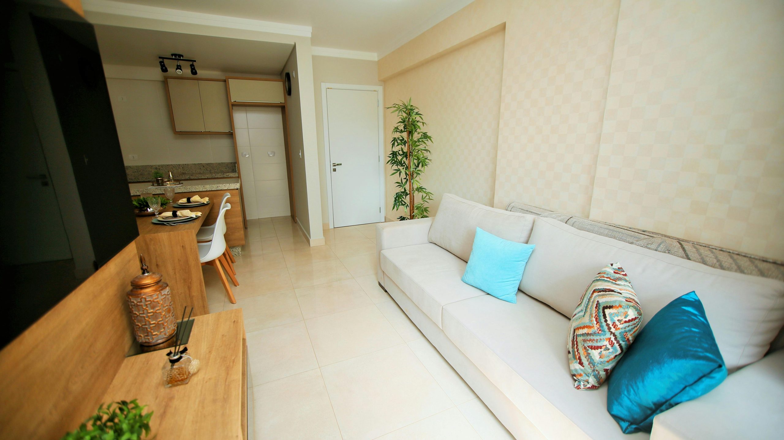 Serene Beige Haven with Creamy Sofa and Vibrant Teal Touches