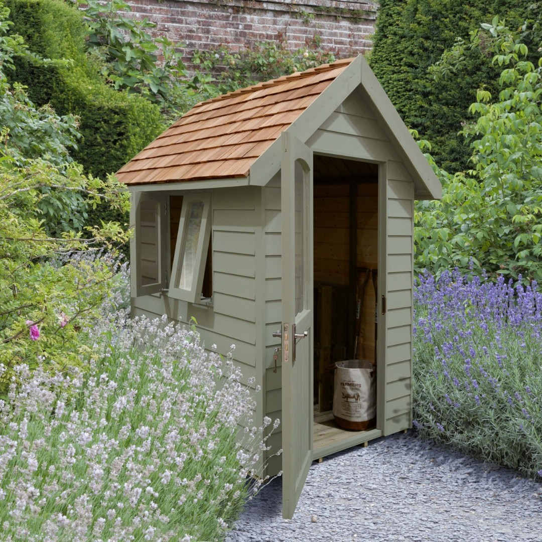 Compact Garden Shed with a Charming Seating Nook