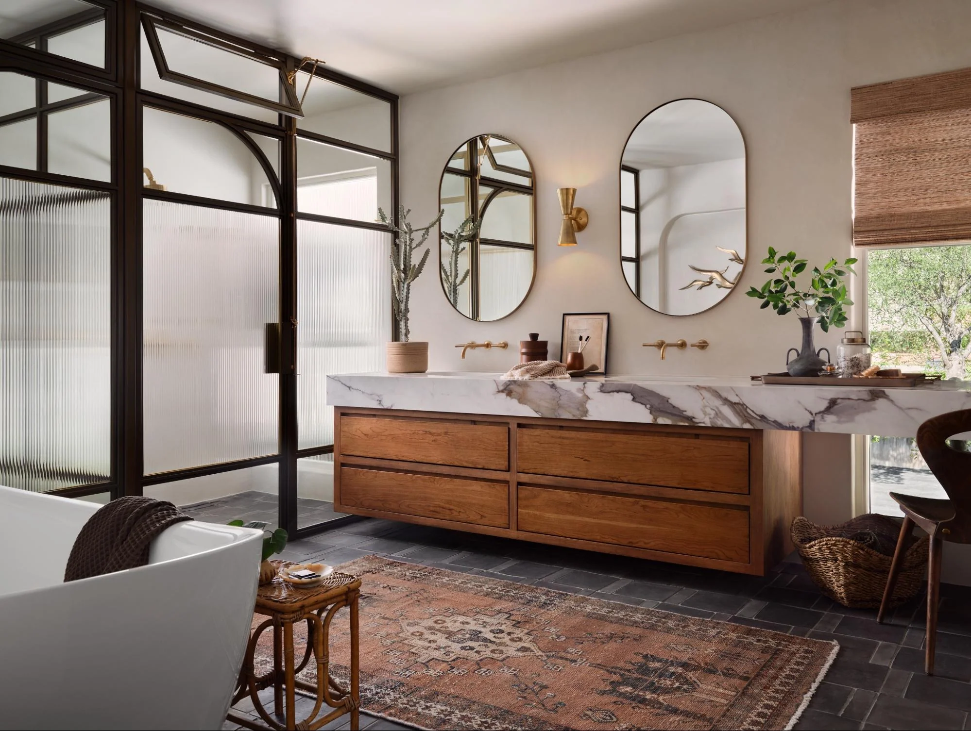 Open Bathroom with Double Sink and Curved Mirrors
