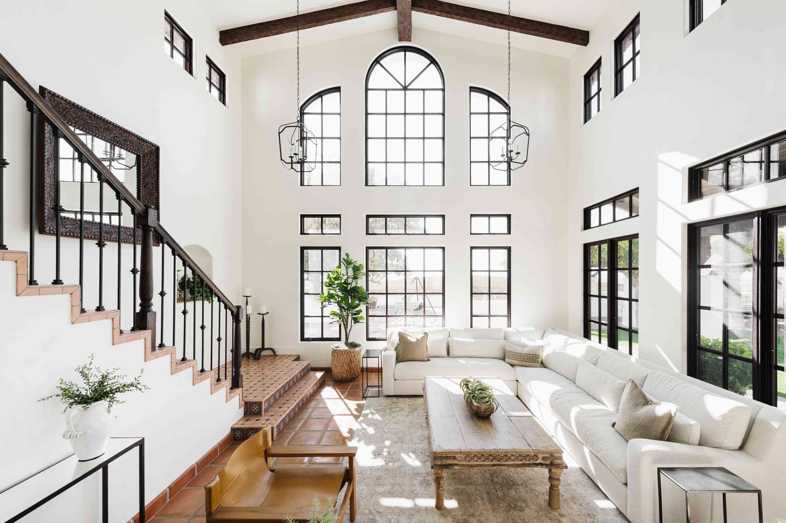 Earthy Elegance: White Sectional Amid Terracotta and Black Accents