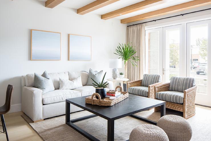 Rustic Elegance: White Sofa Living Room with Exposed Wood Beams and Rattan Touches